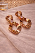 Gold Tone Sculpted Drop Earrings with Crystal Accent