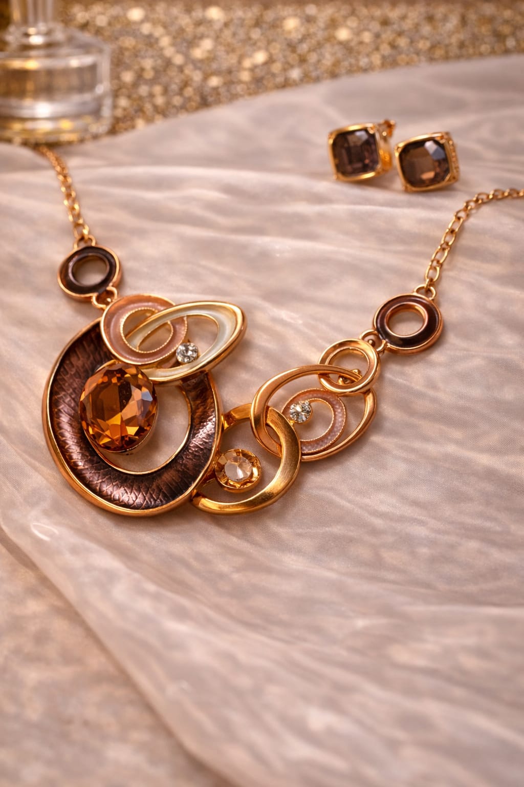 Multi-Layered Gold Tone Statement Necklace with Crystal Accents